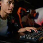 Young adults playing in a competitive esports tournament, deeply focused on gaming.